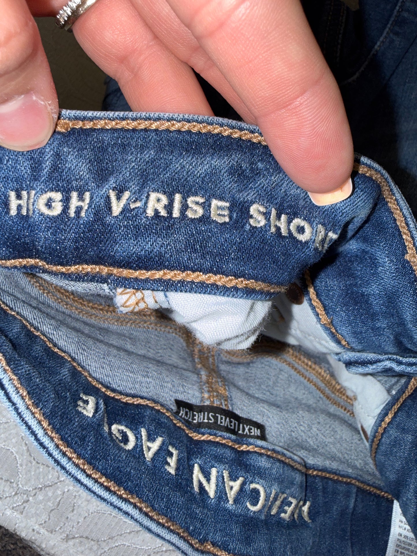American Eagle (0) Distressed High V-Rise Shortie Jean Shorts