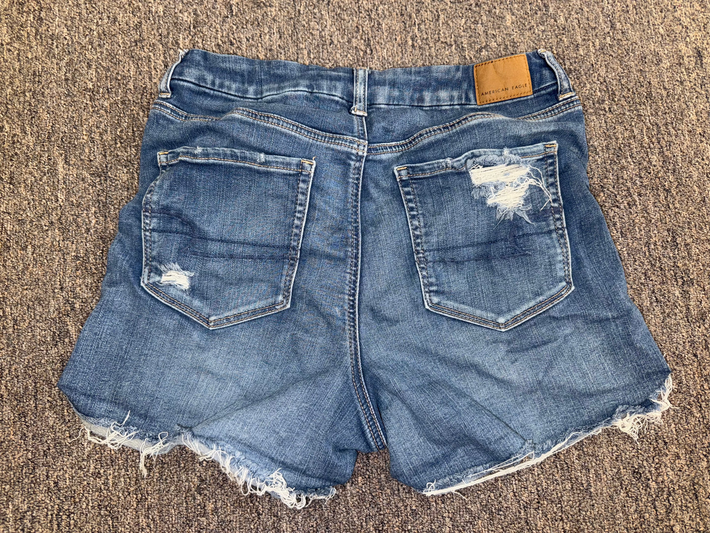 American Eagle (12) Distressed Denim Curvy High Rise Shortie Jean Shorts