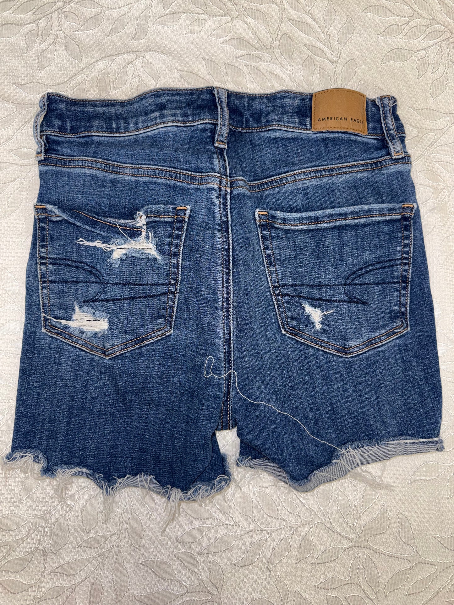 American Eagle (0) Distressed High V-Rise Shortie Jean Shorts