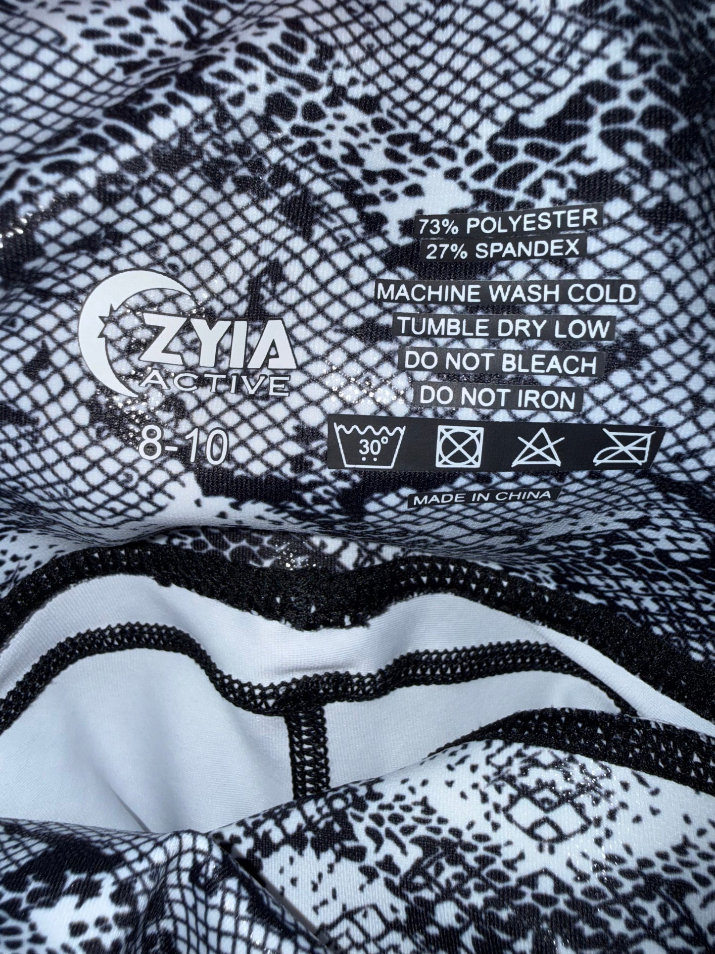 Zyia Active (8-10) Black/White Pattern Capris Leggings with Side Slip Pockets